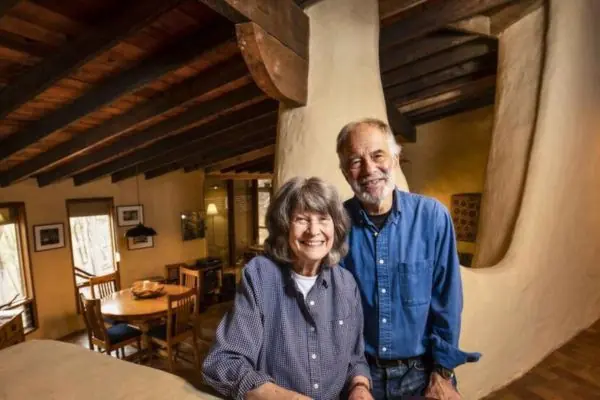 happy couple living in adobe house