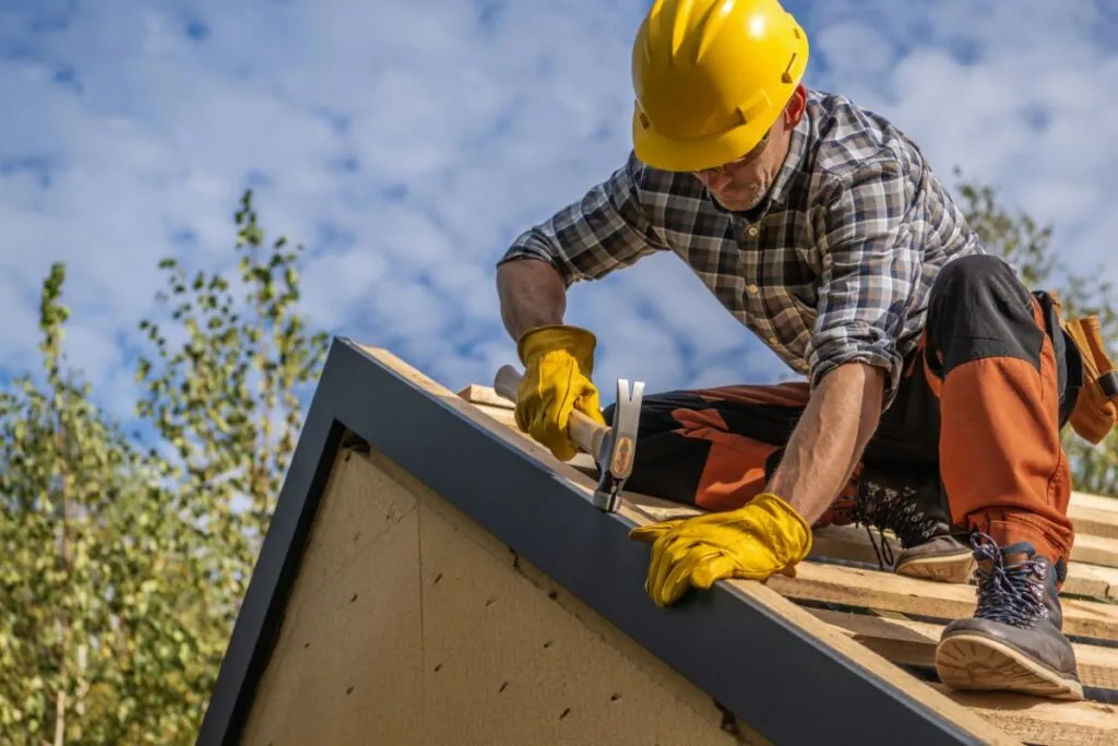 professional roof contractor working on a roof installation