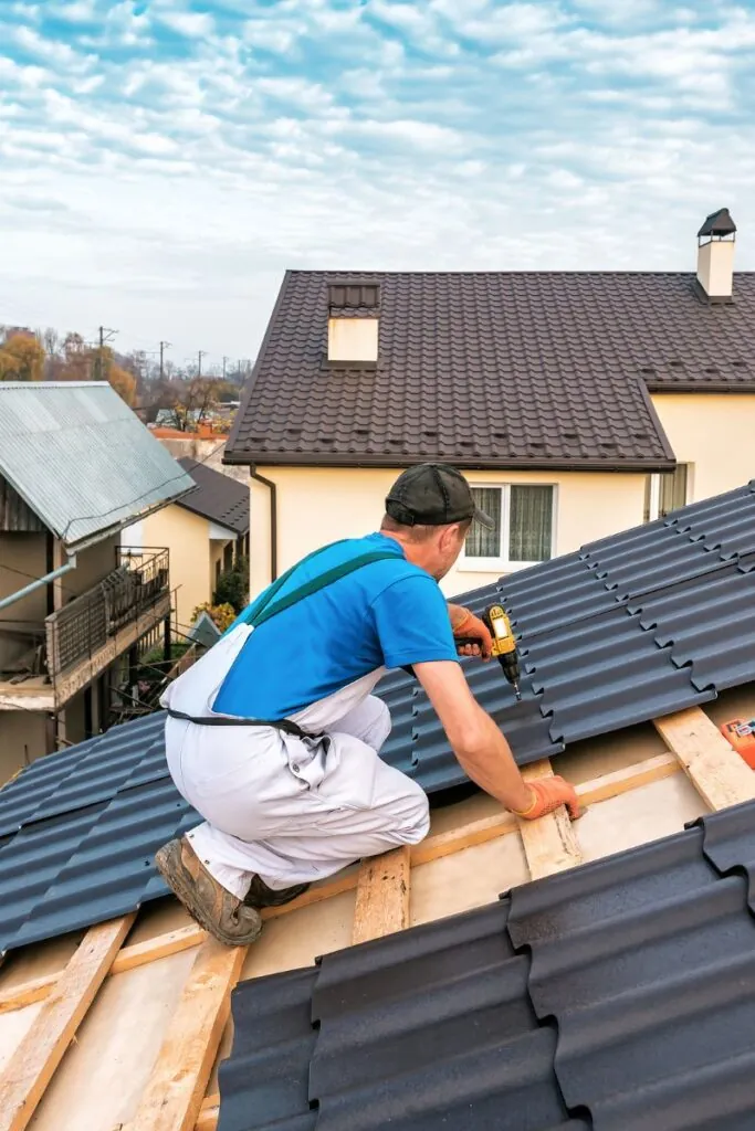 professional roof master repairing residential roof