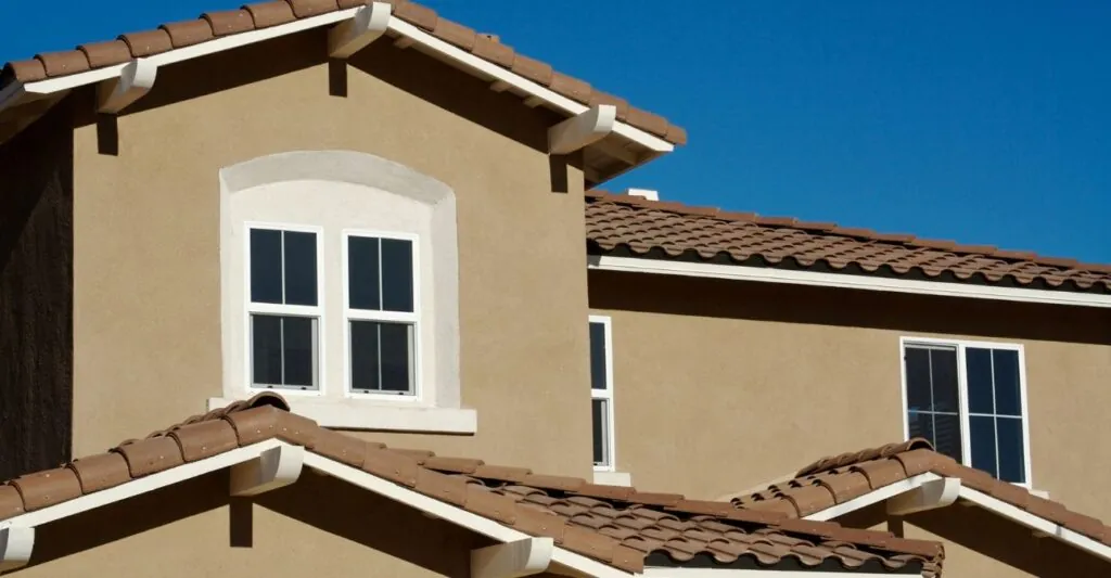 abstract of new stucco wall construction and windows